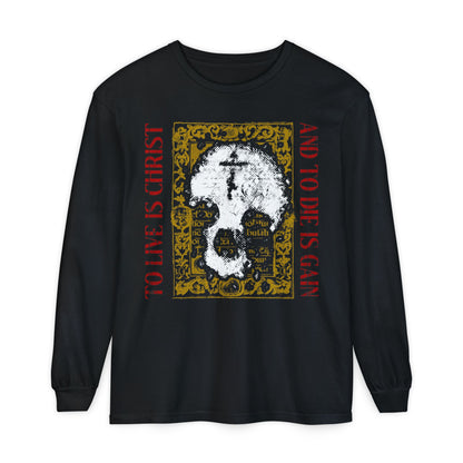 Black long-sleeve shirt featuring a white skull with cross, gold manuscript texture, and red "To live is Christ, to die is gain" text—reflecting Orthodox Christian faith from Philippians 1:21.