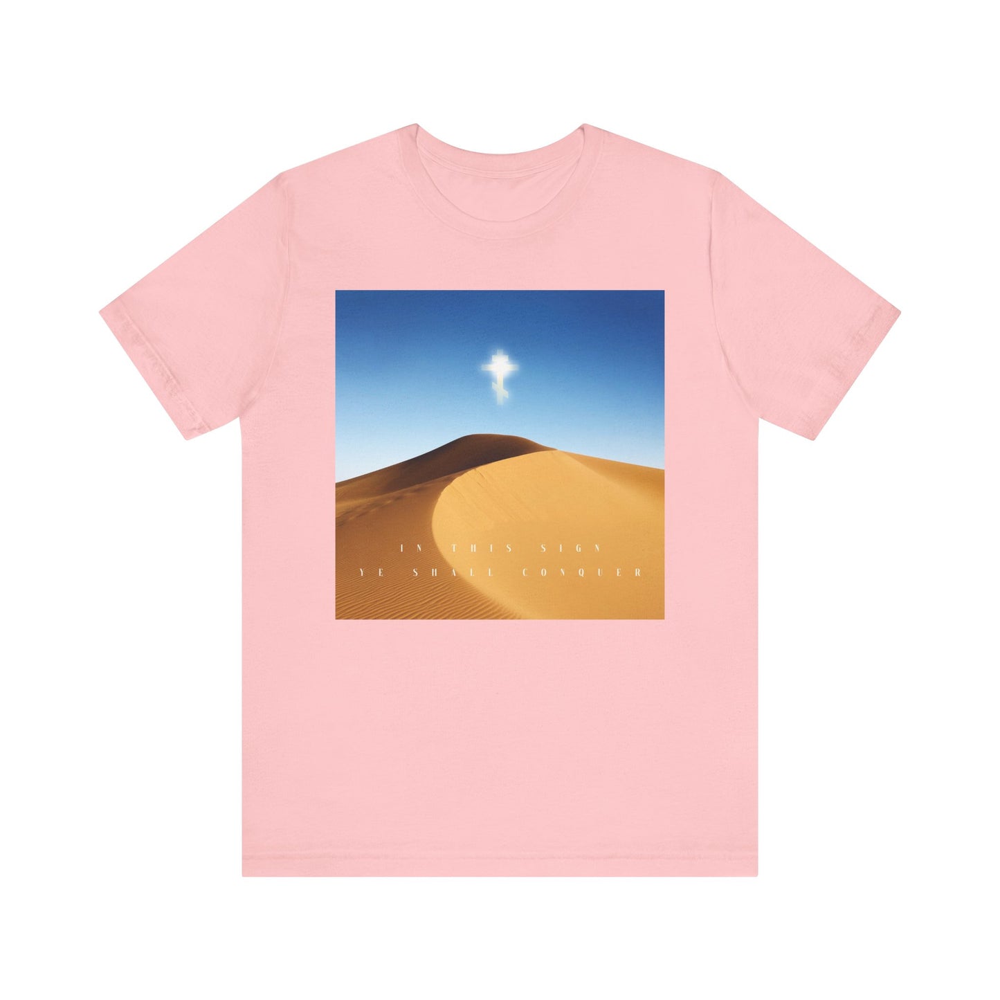 The In This Sign Ye Shall Conquer Desert Sun Scene Orthodox Christian Tee is a pink cotton unisex shirt featuring a Cross and the phrase BY THIS SIGN YE SHALL CONQUER—honoring the Elevation of the Cross.
