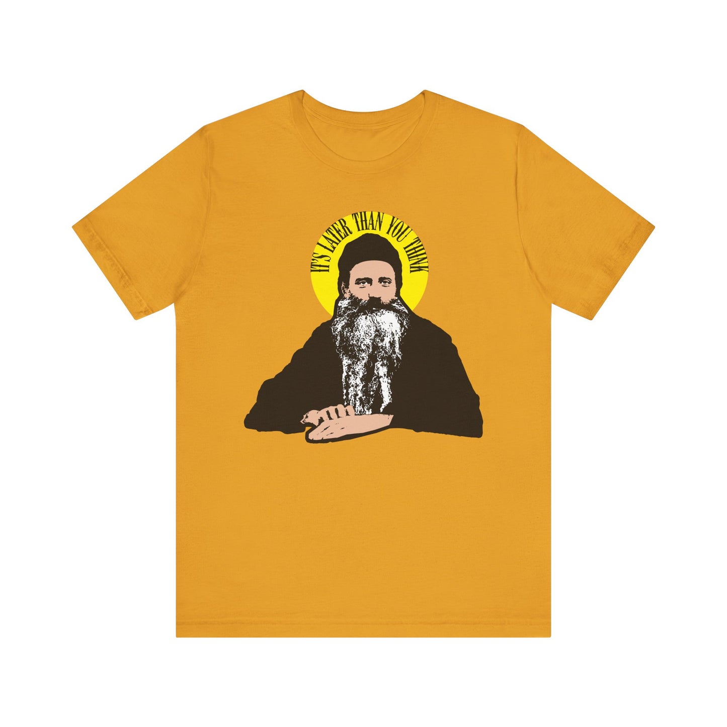 Mustard unisex tee featuring St. Seraphim Rose with a yellow halo and the quote "It's Later Than You Think" in a modern Orthodox design on lightweight cotton.