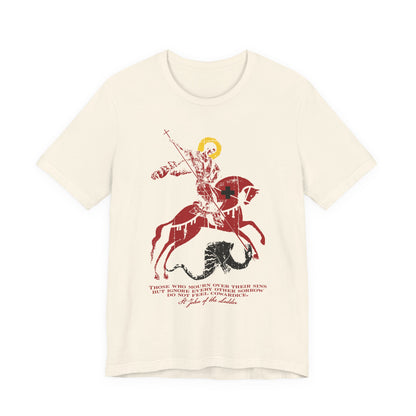 Natural lightweight cotton unisex tee featuring a St George slaying the dragon iconographic illustration with a quote inspired by St John Climacus on mourning over one’s sins, printed below the image.
