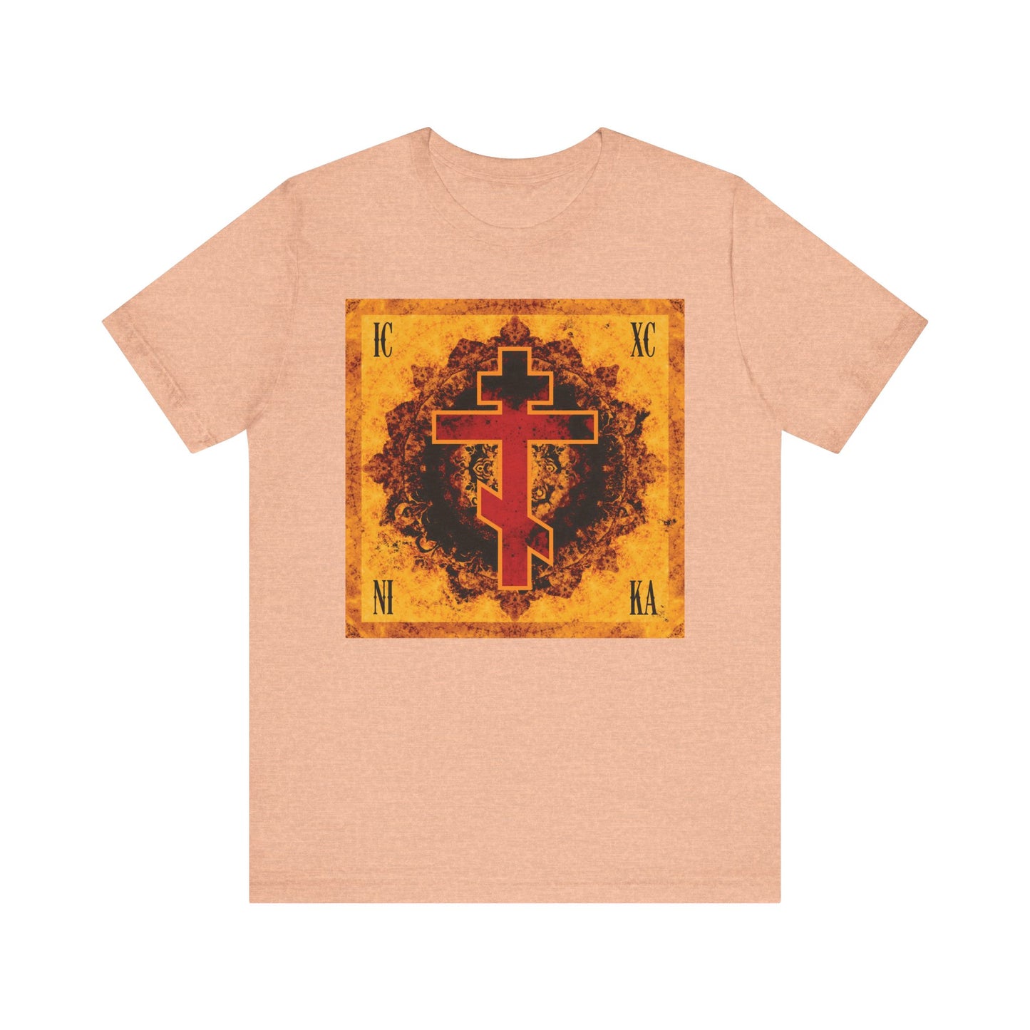 Heather peach t-shirt featuring a bright orange and red ornate Byzantine cross with Greek ICXC NIKA letters set on a textured square background, inspired by the Orthodox Christian Elevation of the Precious Cross and the hymn "Lord I Have Cried.