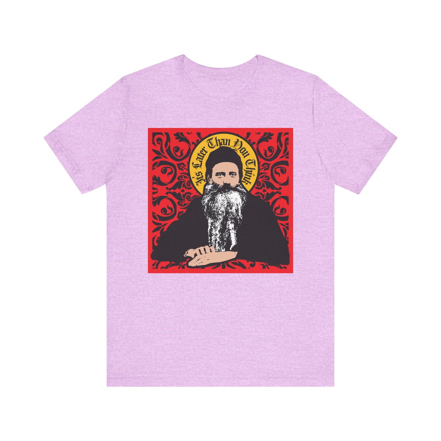 Heather Prism Lilac unisex tee featuring Saint Seraphim Rose of Platina in an icono-graphic style with "It's Later Than You Think" text on a red ornate background—a thoughtful choice for Orthodox Christians.