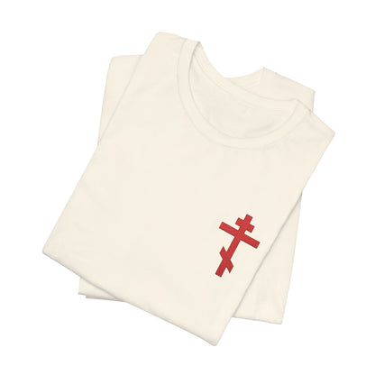 Two folded white cotton unisex t-shirts feature a small red embroidered Orthodox cross on the chest and “May I Never Boast Except in the Cross” (Gal 6:14), inspired by Christian faith.