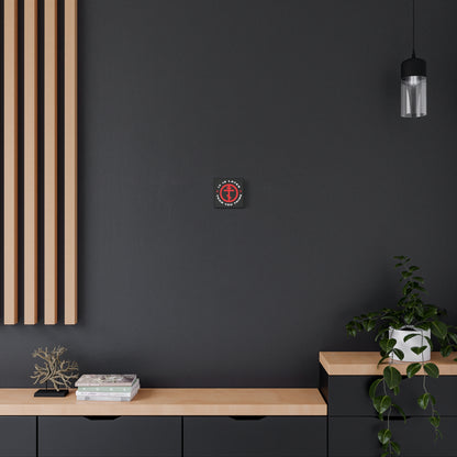 A modern black and wood room features "It Is Later Than You Think" Christian wall art by Fr Seraphim Rose—Orthodox Cross in Circle, evoking tranquility with memento mori, plants, books, and decor outshining darkness.