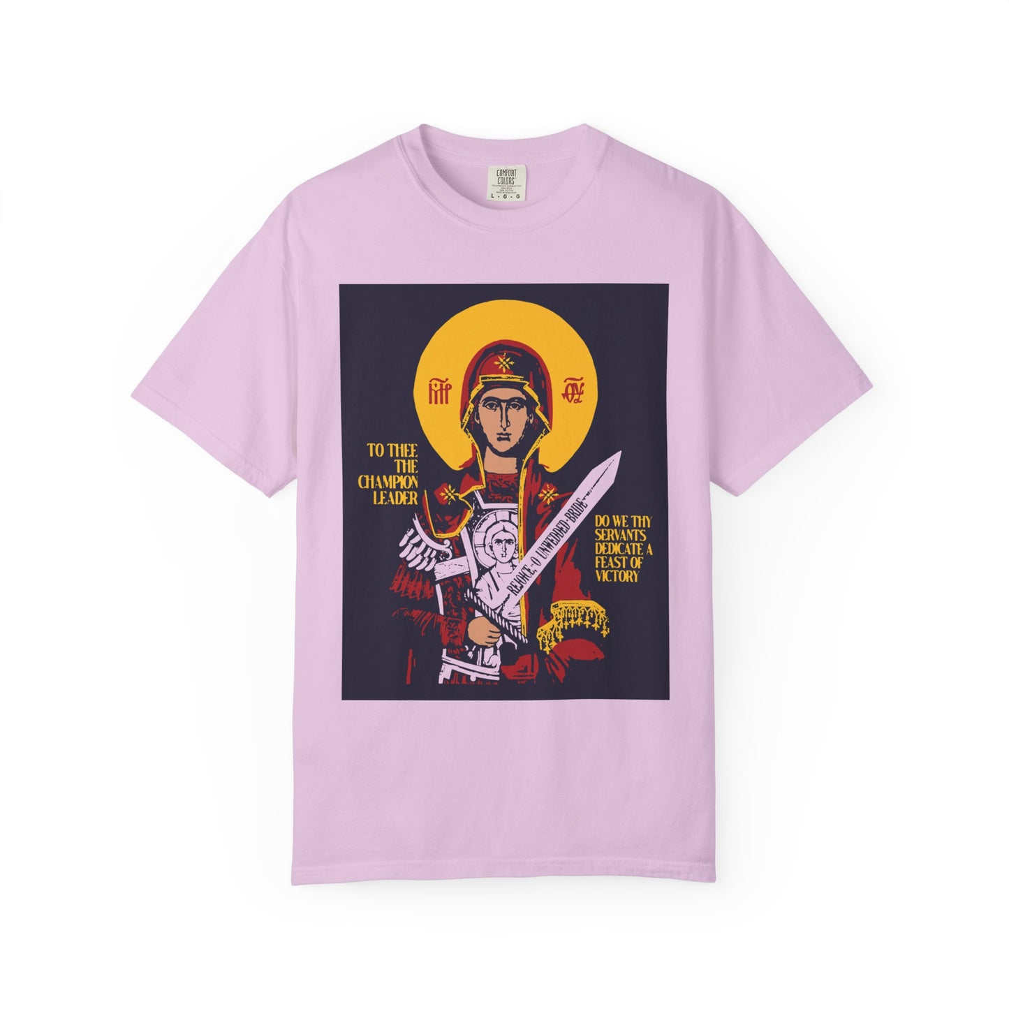 Orchid heavyweight cotton unisex tee featuring a Byzantine-style icon of the Mother of God (Theotokos) with sword, titled "To Thee the Champion Leader," flanked by angels and adorned with gold text.