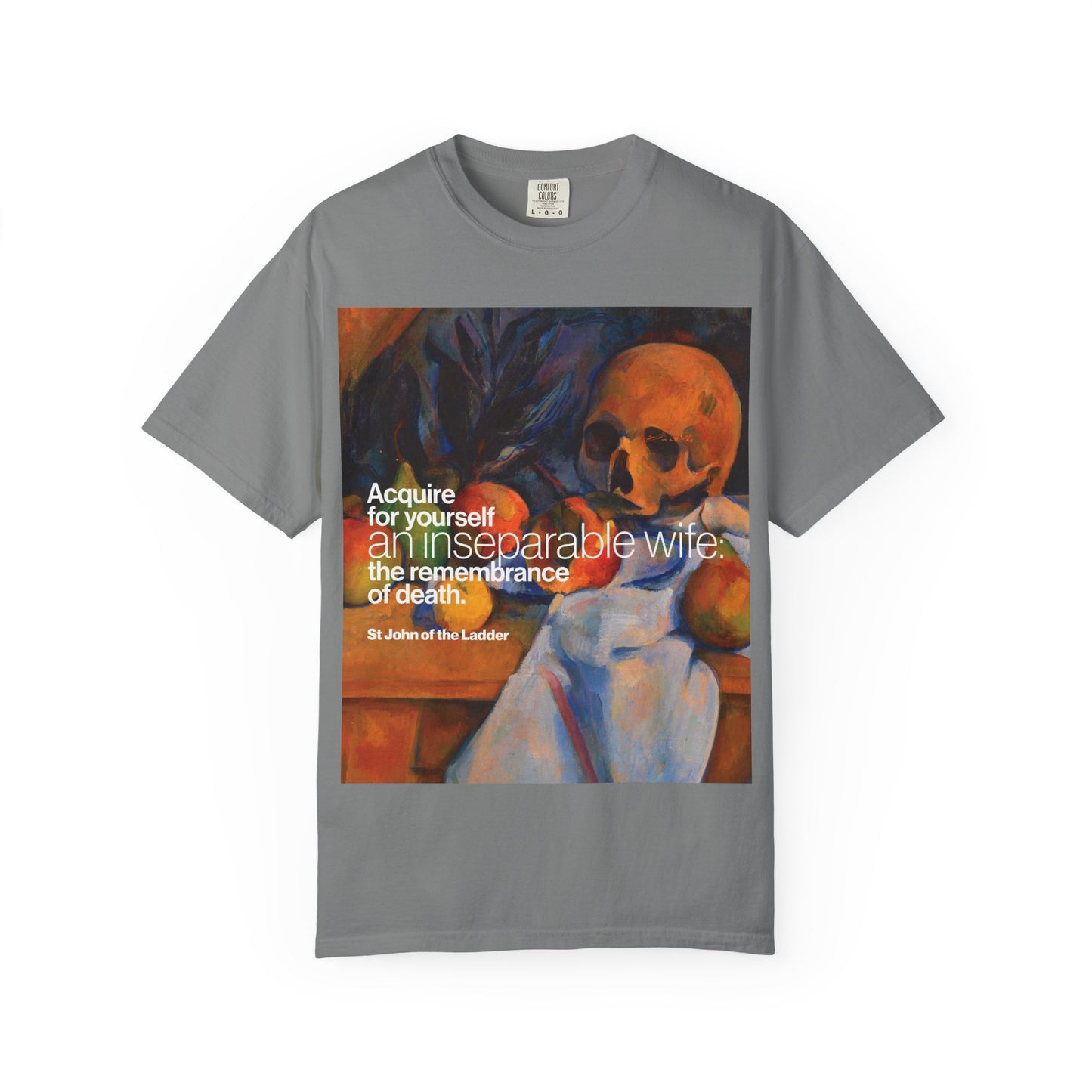 Grey heavyweight cotton unisex t-shirt titled “Acquire an Inseparable Wife (St John Climacus),” featuring Cezanne’s still life with skull and the thought-provoking Orthodox Christian quote: “Acquire for yourself an inseparable wife—the remembrance of death.”.
