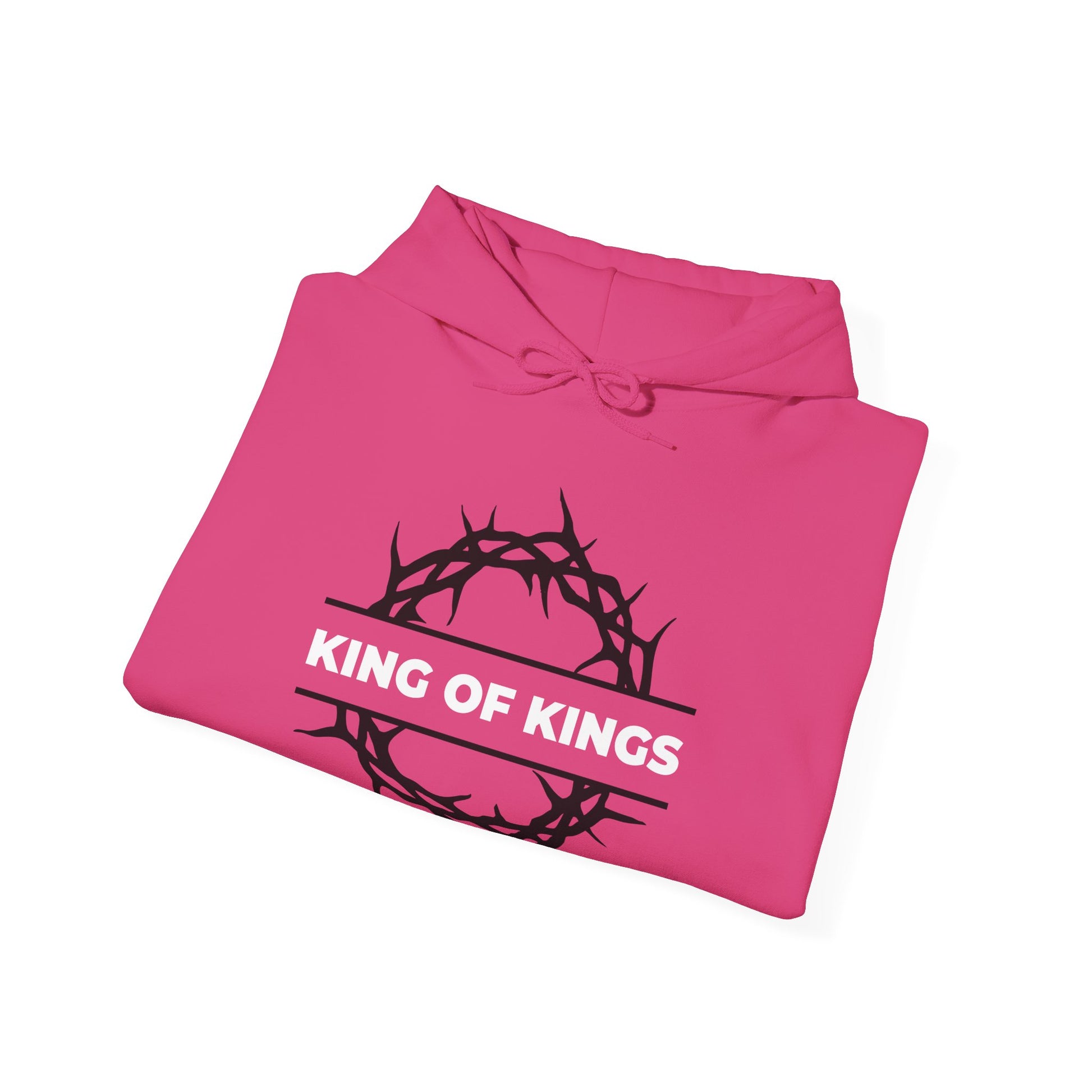 A folded pink hoodie displays "King of Kings" with a crown of thorns, referencing Revelation 19:16. Design: King of Kings Crown of Thorns | The King of Glory | Christ is King | Orthodox Christian Hoodie.
