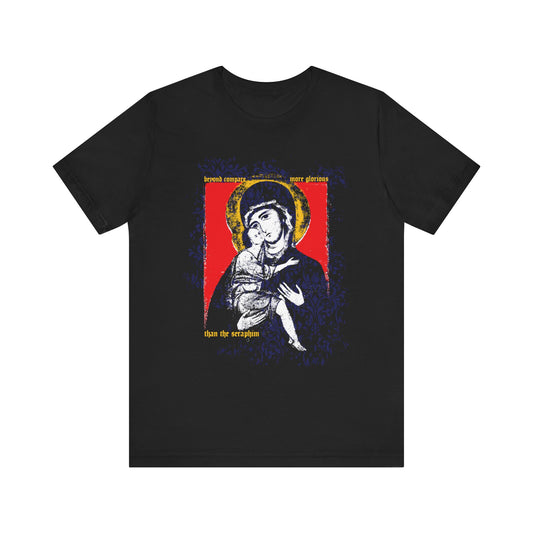Black "Beyond Compare More Glorious Than the Seraphim" T-shirt features Vladimir Theotokos icon-style art with floral texture and gold text, inspired by Orthodox tradition. Lightweight cotton.