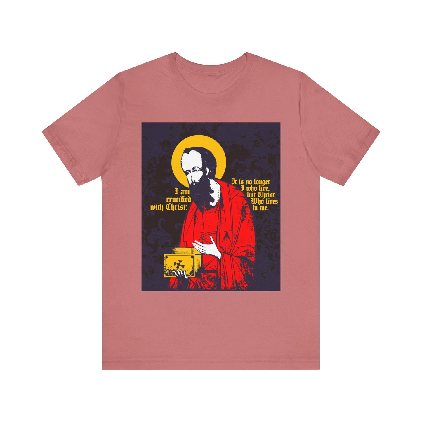Mauve unisex lightweight cotton tee featuring an iconographic illustration of St. Paul holding the Gospel, with yellow and white text from Galatians 2:20, "I am crucified with Christ," celebrating new life and faith in the Son of God.