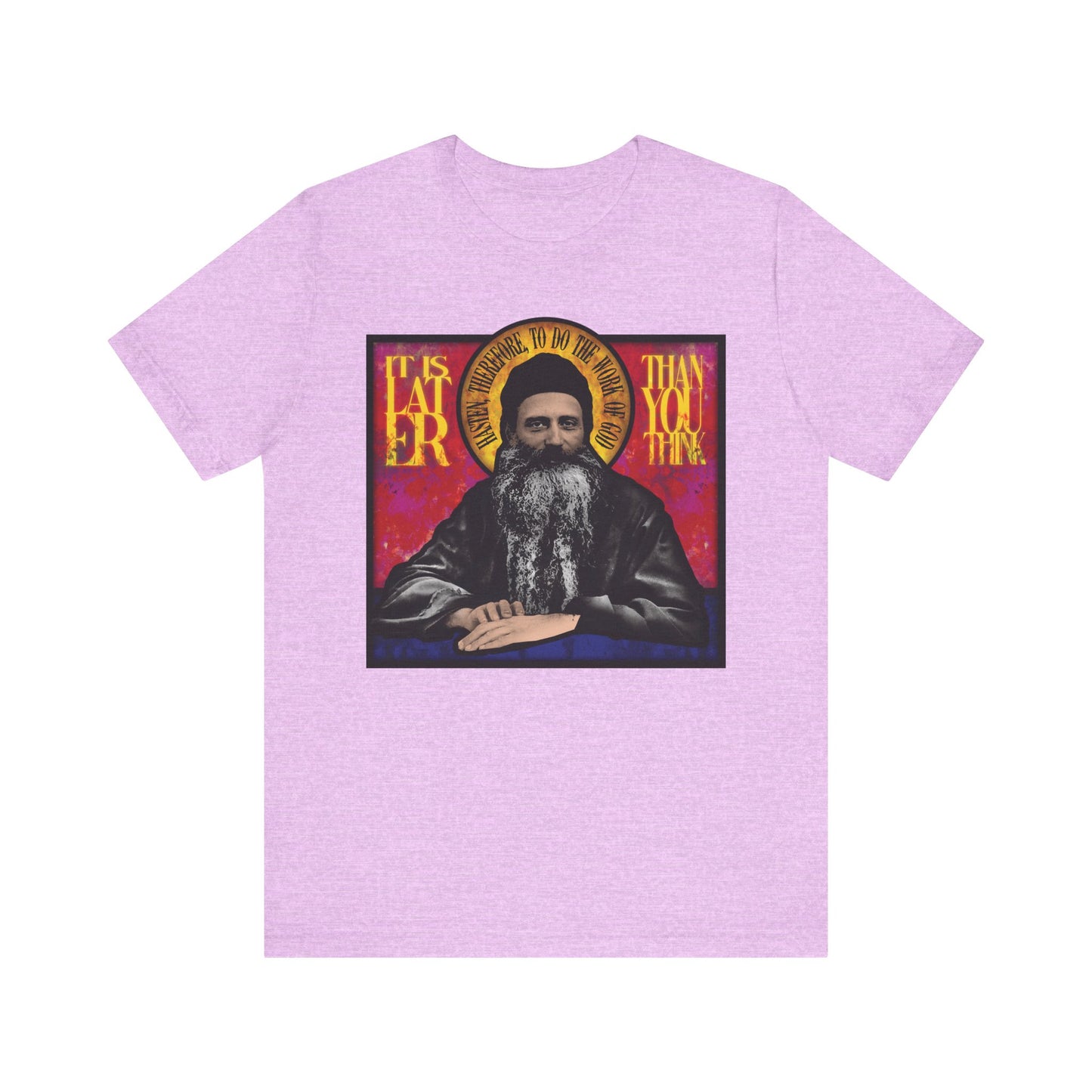 Heather Prism Lilac unisex tee featuring a stained glass design of Fr. Seraphim Rose, American Orthodox monastic saint, with "It is later than you think" text. Lightweight cotton for comfort and reflection on deeper meaning.