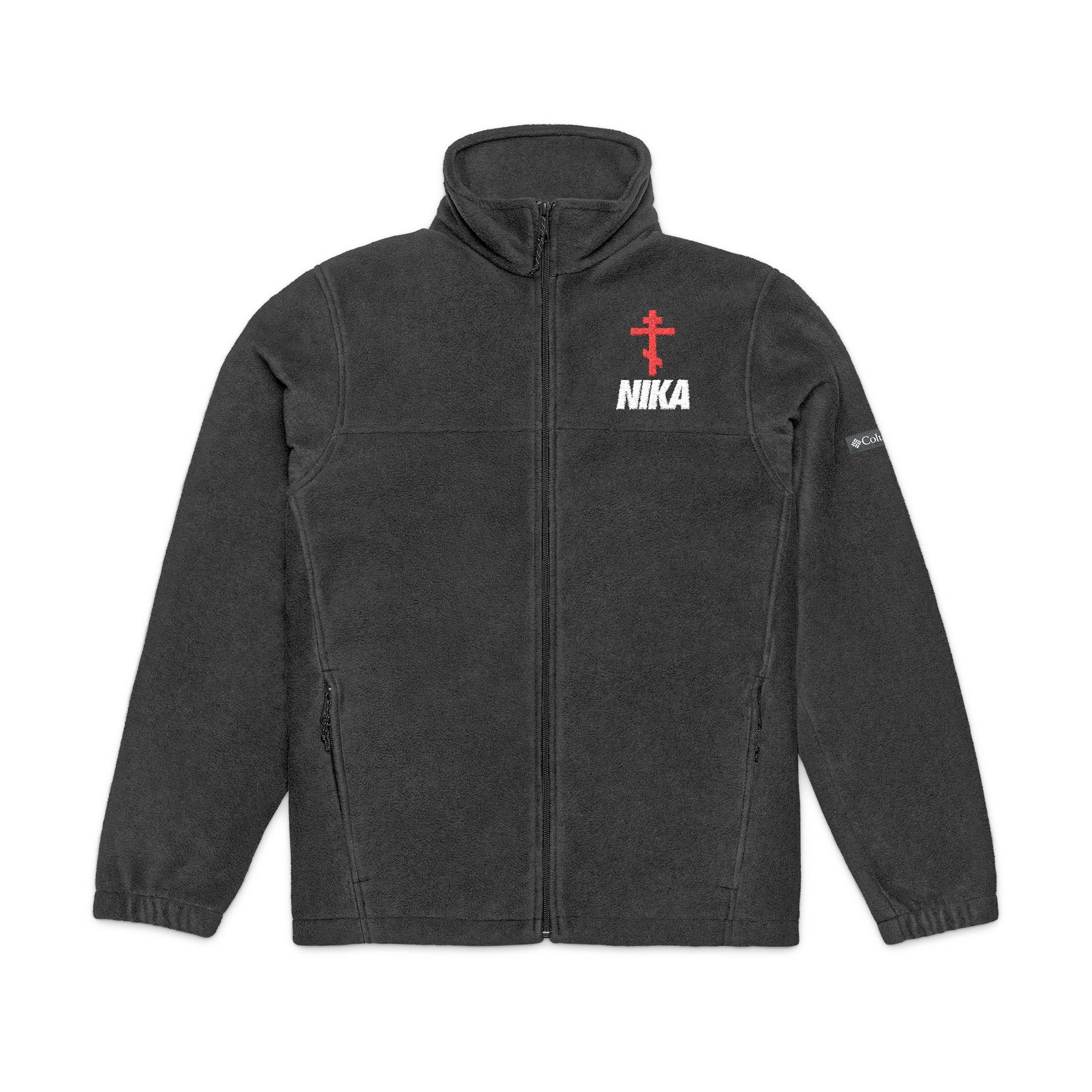 A unisex Columbia fleece jacket by Remembrance of Death in dark gray, featuring a red Orthodox cross above white NIKA text on the chest, symbolizing victorious faith, plus a white Columbia logo on the sleeve. Inspired by Revelation 3:21.