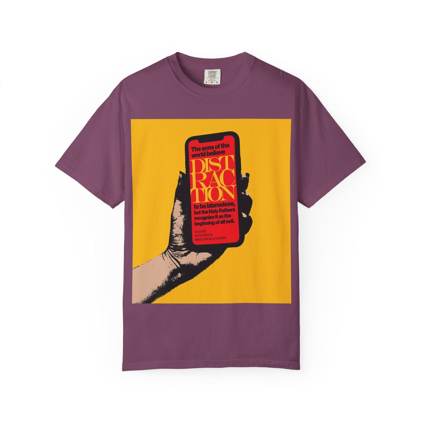 Berry-colored heavyweight cotton unisex tee titled “Distraction is the Beginning of All Evil (St Ignatius Brianchaninov)”, featuring a graphic of a hand holding a phone with bold red text on a yellow background, inspired by the wisdom of the Holy Fathers and St Ignatius Brianchaninov.