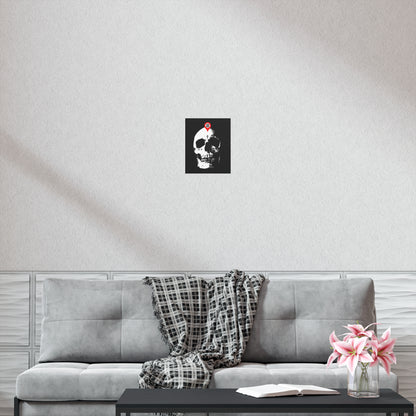 A gray sofa with a plaid blanket, a coffee table with flowers and a book, and the "You Will Be Here Maps Marker on Skull Design" Orthodox Christian art poster evoke the memento mori theme, recalling St Ignatius Brianchaninov’s reflections on spiritual death.