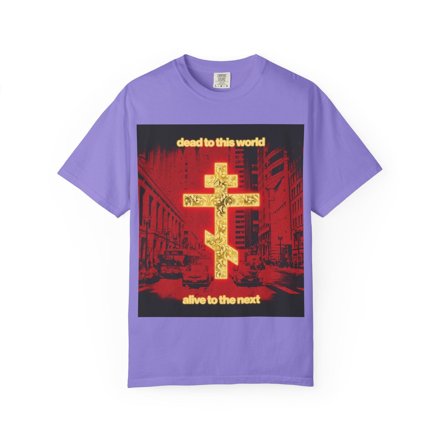 Introducing the “Dead to This World Alive to the Next | Glowing Gold Cross Red Cityscape” heavyweight cotton unisex tee in violet—featuring a glowing gold cross against a striking red cityscape, with text paying homage to St. Ignatius and reflecting on death and eternity.