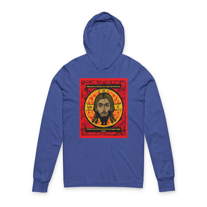 The Remembrance of Death “Made Without Hands” Orthodox Hooded Shirt features a graphic of Jesus Christ’s face within a golden halo, surrounded by red, black, and yellow patterns and hymn-inspired text in the style of an Orthodox icon.