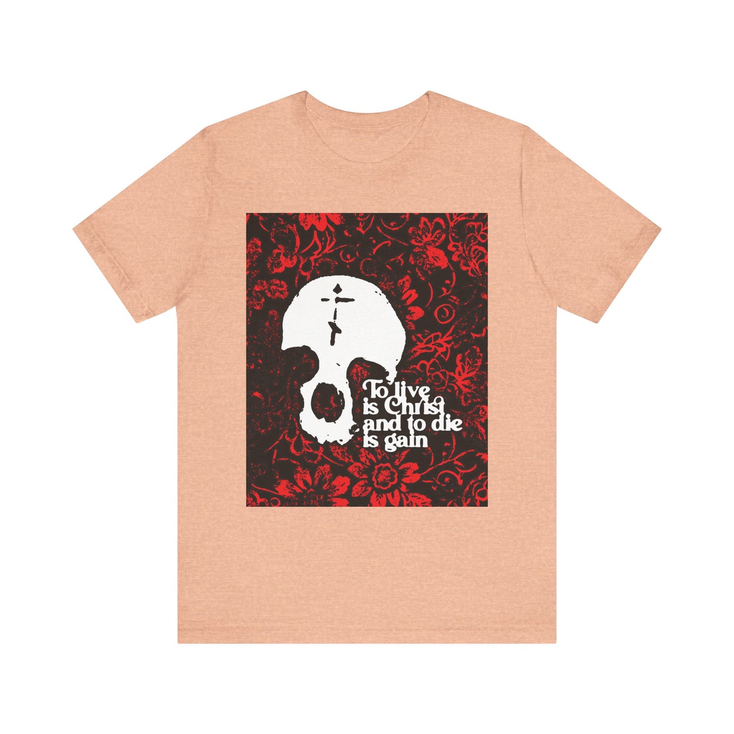 Heather peach unisex tee featuring a white skull with cross on a red floral background and the text "To Live is Christ To Die is Gain," inspired by Philippians 1:21 and Orthodox Christian faith.