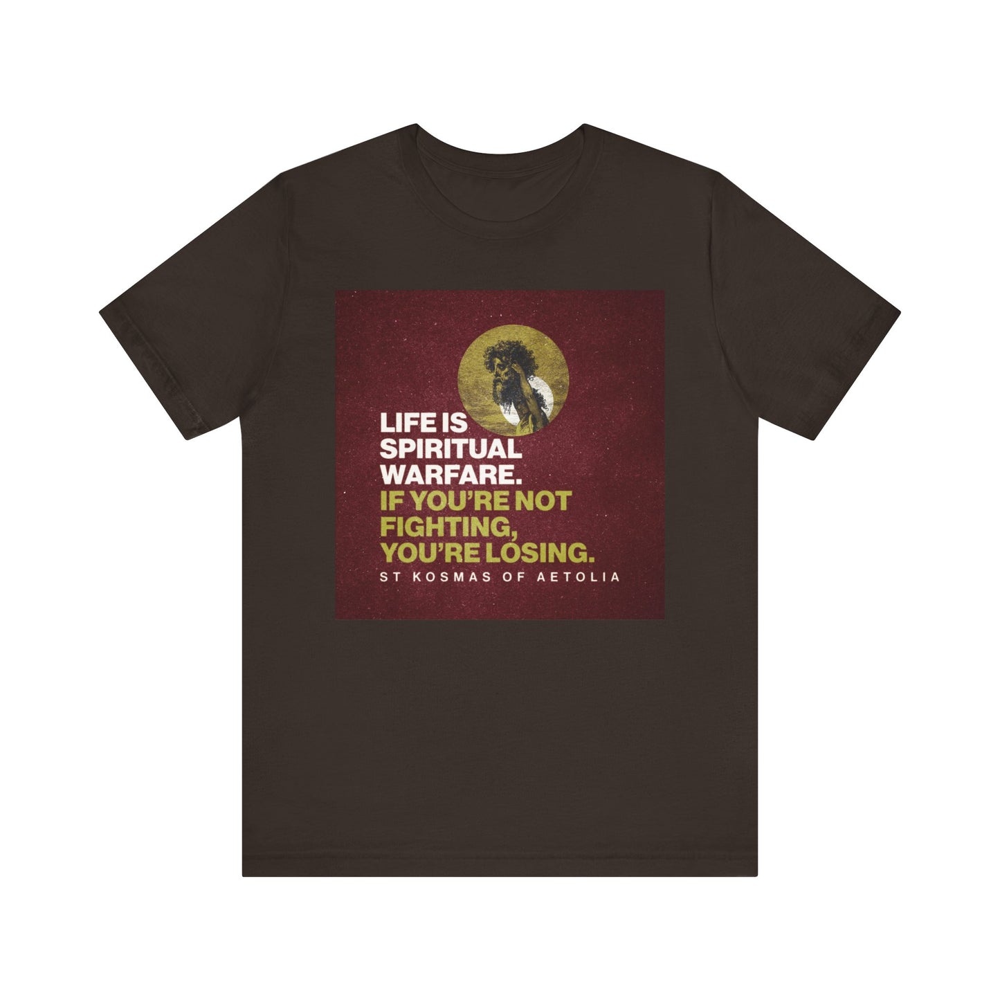 Brown t-shirt featuring the quote "Life is Spiritual Warfare. If You're Not Fighting, You're Losing," with an image of David slaying Goliath at the center, referencing Orthodox Christian faith and symbolizing spiritual warfare.