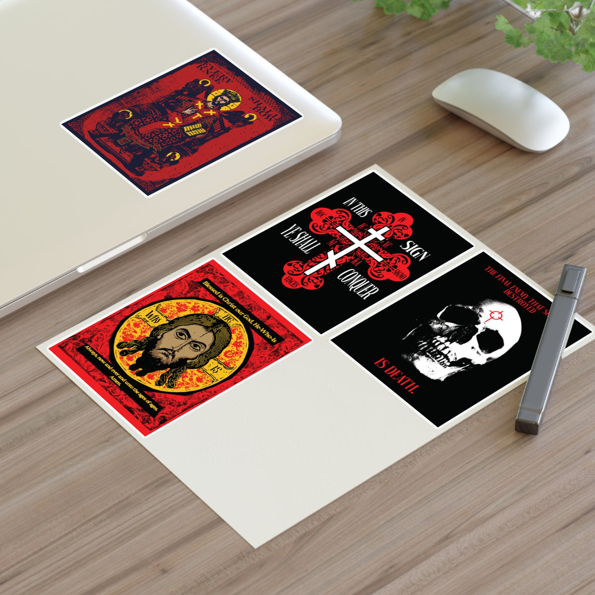 Bestseller Orthodox Sticker Mix No. 3 rests on a desk by a laptop and green plant.