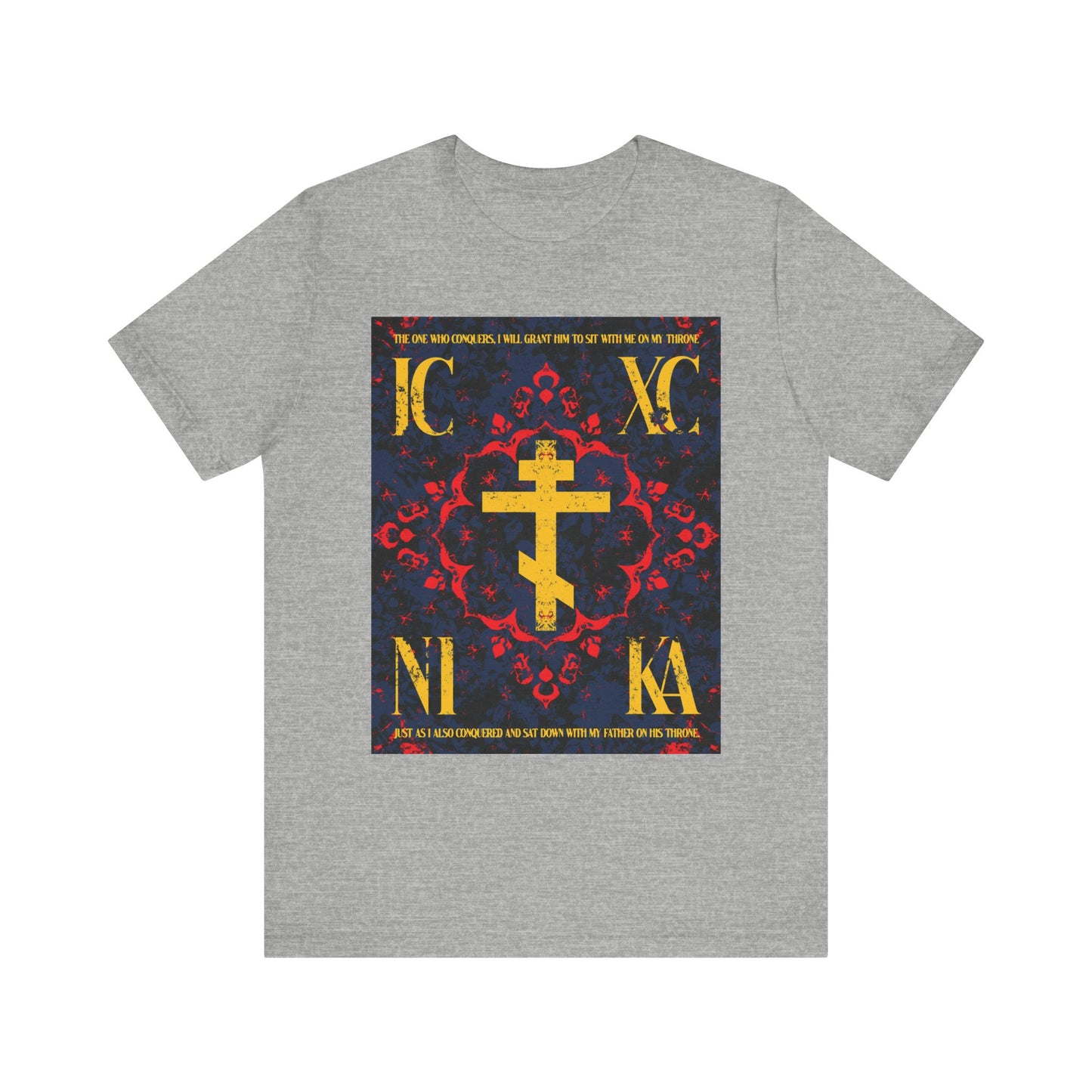 Athletic Heather tee with Medieval floral Orthodox cross, gold IC XC NI KA letters, and “The One Who Conquers” (Revelation 3:21)—symbolizing salvation through both personal effort and God’s grace.