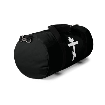 The "White Orthodox Cross" gym duffel bag features a white cross inspired by Gal 6:14 and St. John of Kronstadt, with a shoulder strap—perfect for Orthodox Christians seeking faith-inspired style.