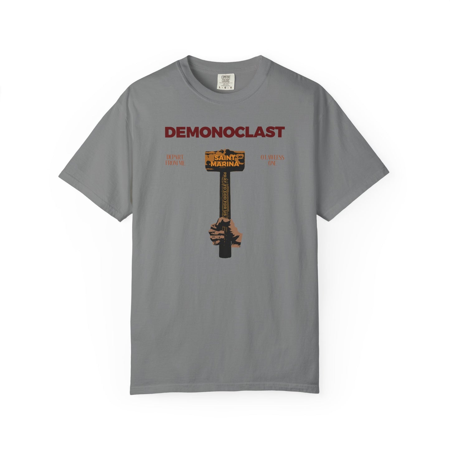 Grey heavyweight cotton tee featuring DEMONOCLAST text and a hand holding a cross marked “St. Marina's Hammer," honoring the Great Martyr Marina—Orthodox unisex design inspired by unseen warfare and martyrdom.