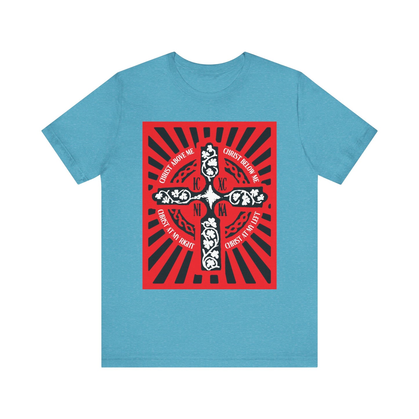 Heather aqua unisex tee with a red and black ICXC NIKA Celtic cross graphic, white text from the Lorica of St. Patrick, and rays and floral details inspired by Orthodox Christian tradition.