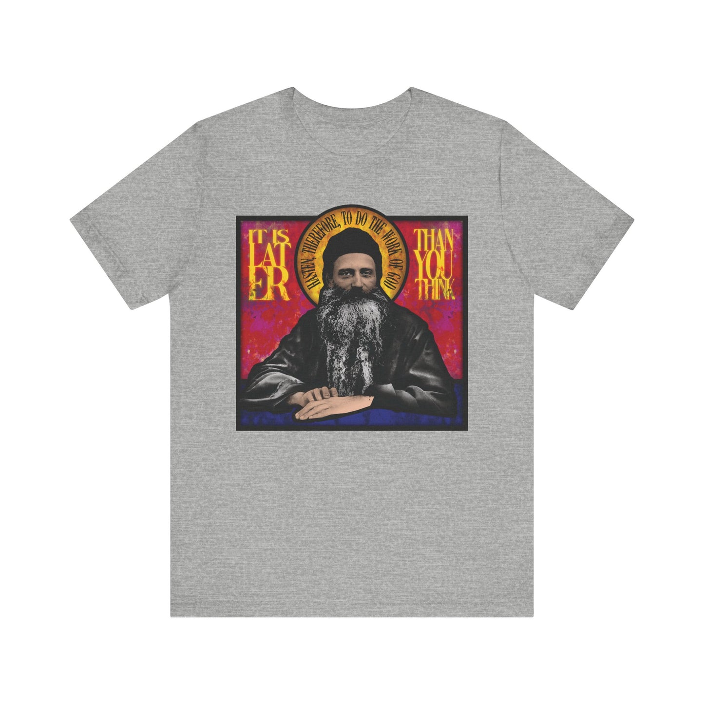 Athletic Heather t-shirt with stained glass artwork of Fr. Seraphim Rose and the words "It Is Later Than You Think" in gold and red—a bold reminder of resurrection and the Kingdom of Heaven. Lightweight cotton, unisex fit.