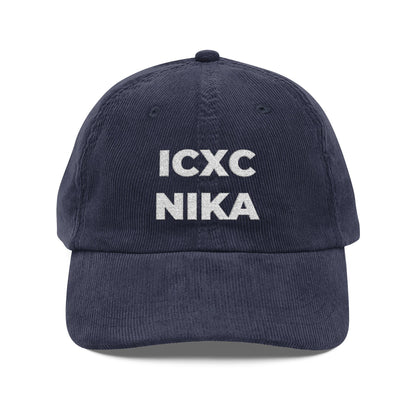 Navy blue embroidered cotton corduroy cap featuring white ICXC NIKA text, the Orthodox Christogram meaning "Jesus Christ Conquers.
