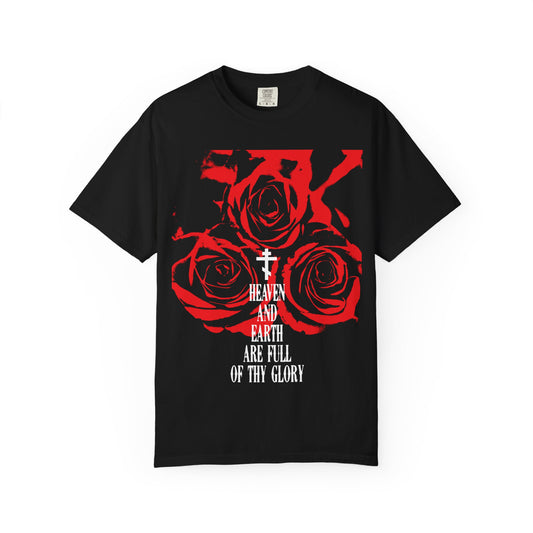 The “Heaven and Earth Are Full of Thy Glory” heavyweight cotton unisex tee is a black t-shirt adorned with red roses and stylish Western typography inspired by the Orthodox liturgical hymn from the Divine Liturgy of St. John Chrysostom, displaying the phrase “Heaven and Earth are full of Thy glory” beneath a cross.