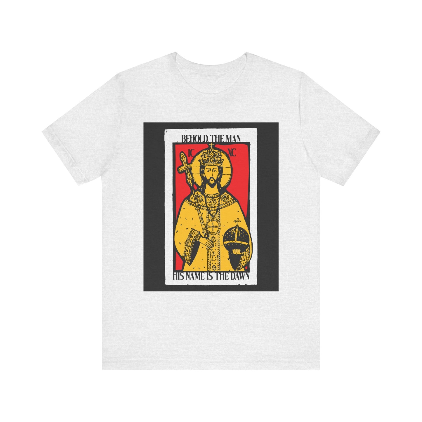 Ash tee featuring red & yellow Christ icon with crown, scepter, and orb; text reads: "Behold the Man His Name is the Dawn" (Zechariah 6:12 LXX). Lightweight cotton unisex design.