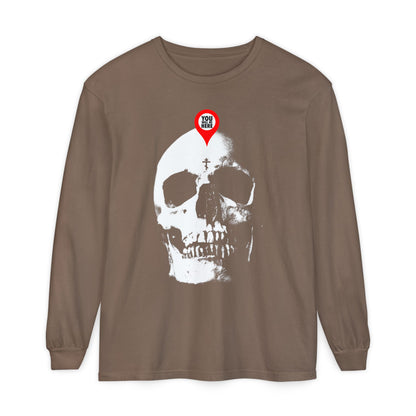 Espresso long-sleeve shirt with a large white skull and red map marker reading "YOU ARE HERE"—a bold Memento Mori reminder. Design: You Will Be Here Maps Marker on Skull | What You Are I Once Was | Remember You Will Die.
