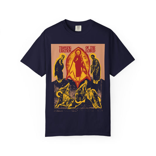 True navy heavyweight cotton unisex tee featuring a punk zine cut-out aesthetic with vintage-style icono-graphic art and the words “Transfiguration of the Lord” above religious figures, inspired by the Transfiguration of Jesus and elements from St. Ephraim the Syrian’s spiritual tradition.
