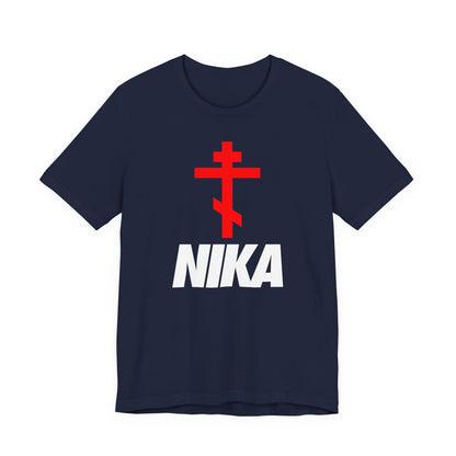 Navy Orthodox Cross with bold white NIKA text, inspired by traditional iconography and NIKE logo mashup. Minimalist athletic ascetic Christian t-shirt celebrating “Jesus Christ Conquers.”.