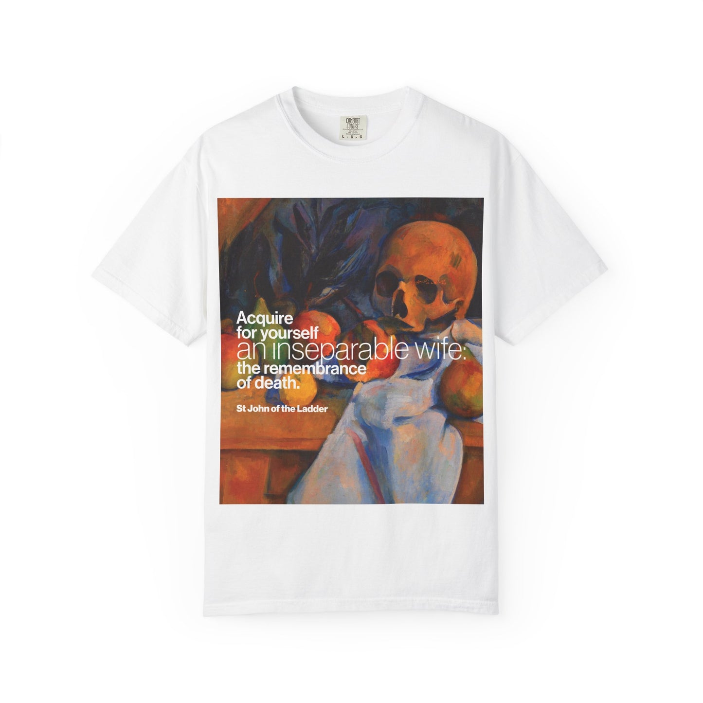 White heavyweight cotton unisex T-shirt titled “Acquire an Inseparable Wife (St John Climacus),” featuring a Cezanne still life with skull and the evocative Orthodox Christian quote: “Acquire for yourself an inseparable wife: the remembrance of death.”.