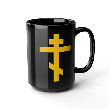Black mug featuring a yellow Orthodox Cross, titled "Precious and Life-Giving Weapon of Unseen Warfare | Scourge of Demons"—a powerful symbol for Orthodox Christians.