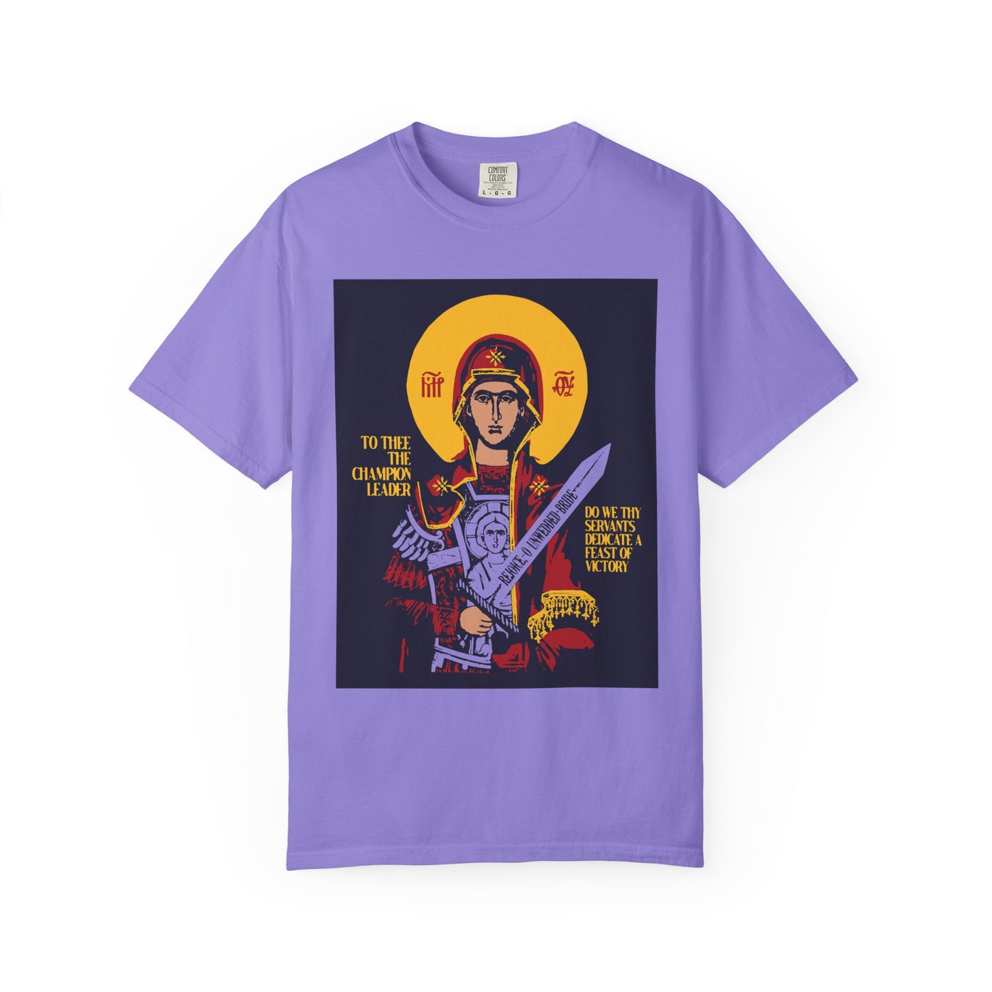 Violet heavyweight cotton unisex t-shirt featuring an icon-style graphic of the Theotokos, Champion Leader, with sword and shield, flanked by angels. "To Thee the Champion Leader" Orthodox design.