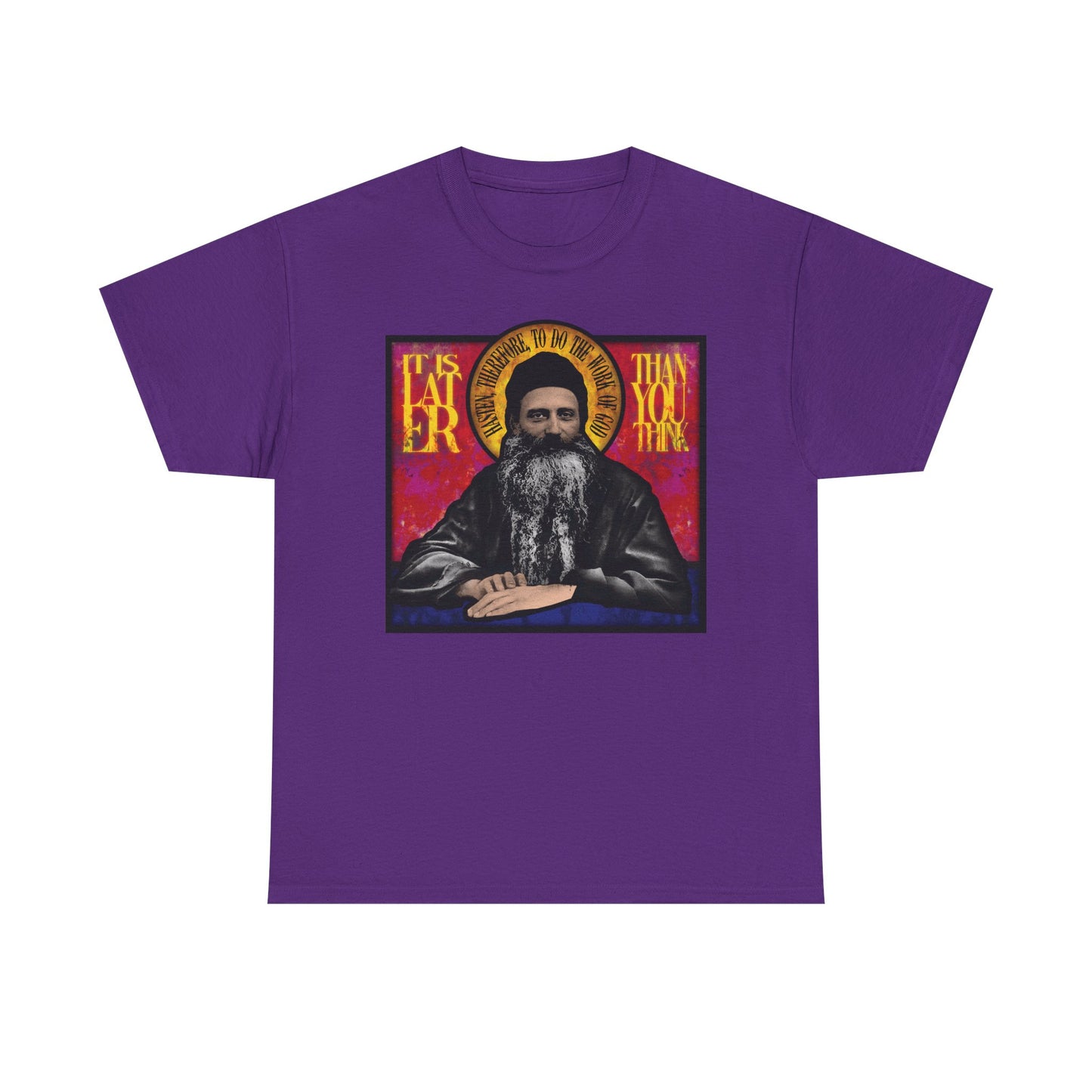 Purple "It Is Later Than You Think" unisex T-shirt featuring a stained glass-style graphic of Fr. Seraphim Rose, an American Orthodox monastic saint, and bold text—a meaningful reminder to seek salvation and contemplate the promise of the Kingdom of Heaven.