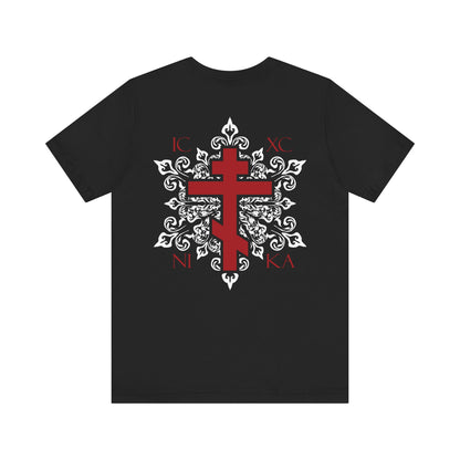 Black lightweight cotton unisex T-shirt featuring a red Orthodox ICXC NIKA cross on the front left chest, intricate white medieval floral designs, and Greek letters with a bold red cross on the back—available as a custom order for a personalized touch.
