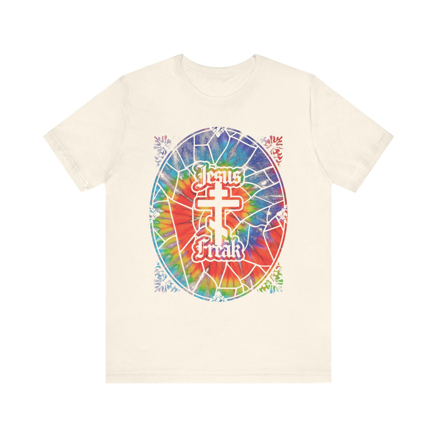Natural-colored lightweight cotton tee featuring a vibrant tie-dyed stained glass window design with "Jesus Freak" text encircling an Orthodox cross—celebrating the bold spirit of the 70s Jesus Movement and its trailblazers.