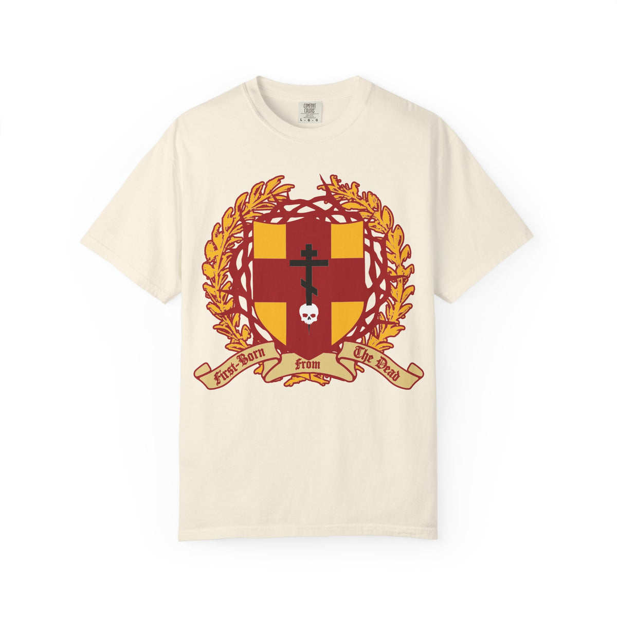 Ivory heavyweight cotton unisex t-shirt featuring a bold heraldic shield with an Orthodox cross piercing a skull, crowned with thorns, and laurel leaves, along with a banner reading “First-Born from the Dead (Col 1:18)”. This striking design is inspired by themes of redemption and sacrifice found in Exodus and Christian tradition.