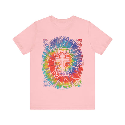 Show your bold faith with this pink unisex tee, featuring a tie-dyed stained glass window design, Orthodox cross, and "Jesus Freak"—inspired by the 70s Jesus Movement hippie style.