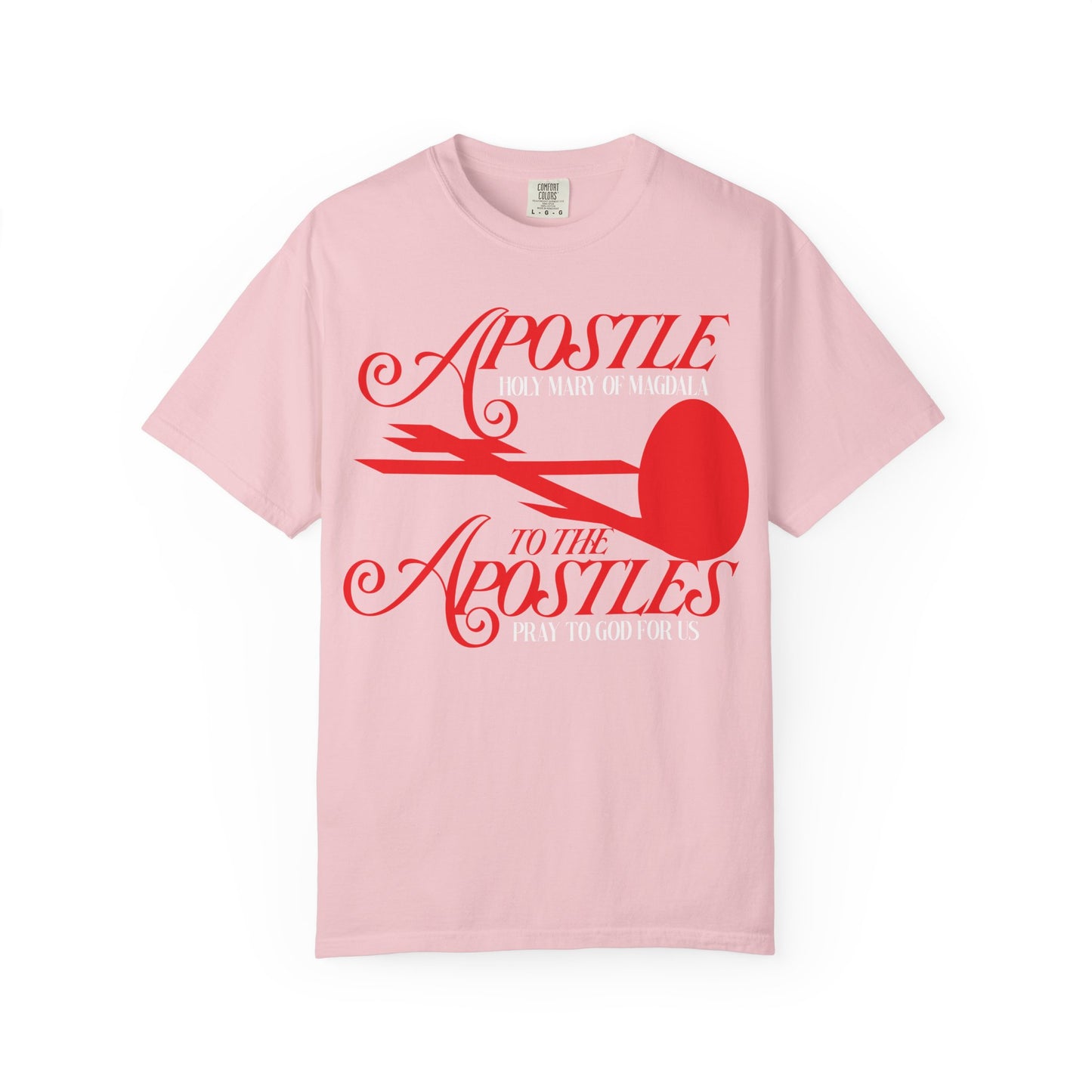 Blossom-colored “Apostle to the Apostles | St. Mary Magdalene” heavyweight cotton unisex tee featuring a red cross and red egg design, inspired by the Burial of the Lord at the Tomb of Jesus.