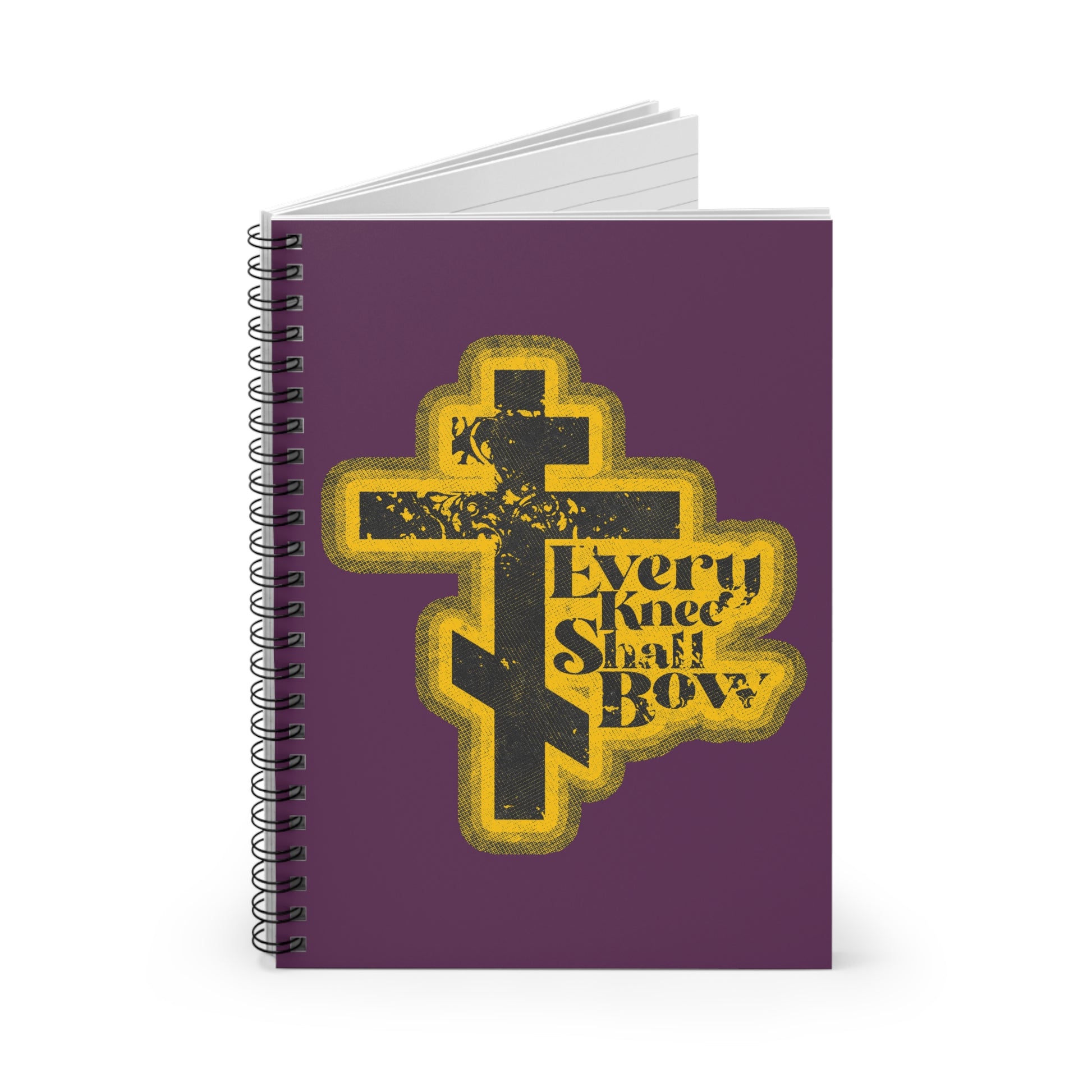 A spiral notebook featuring a 70s distressed halftone comic book design, "Every Knee Shall Bow," inspired by Philippians 2:10-11 and Isaiah 45:23. Orthodox Christian themed.