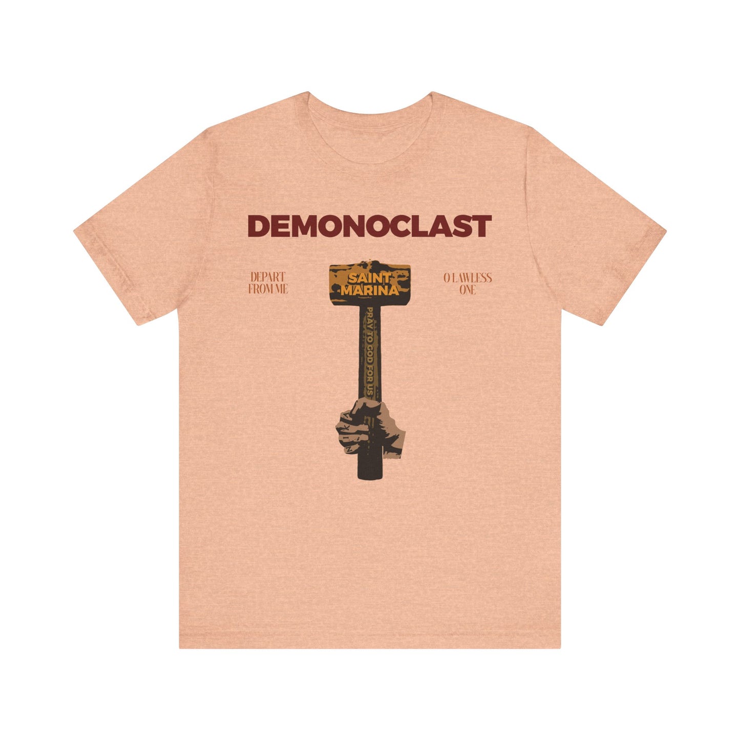 Heather Peach lightweight cotton tee featuring DEMONOCLAST text, St. Marina's hammer, NIKA fist, 'Christ Conquers,' and unseen warfare themes—honoring the Great Martyr's life. Unisex fit.