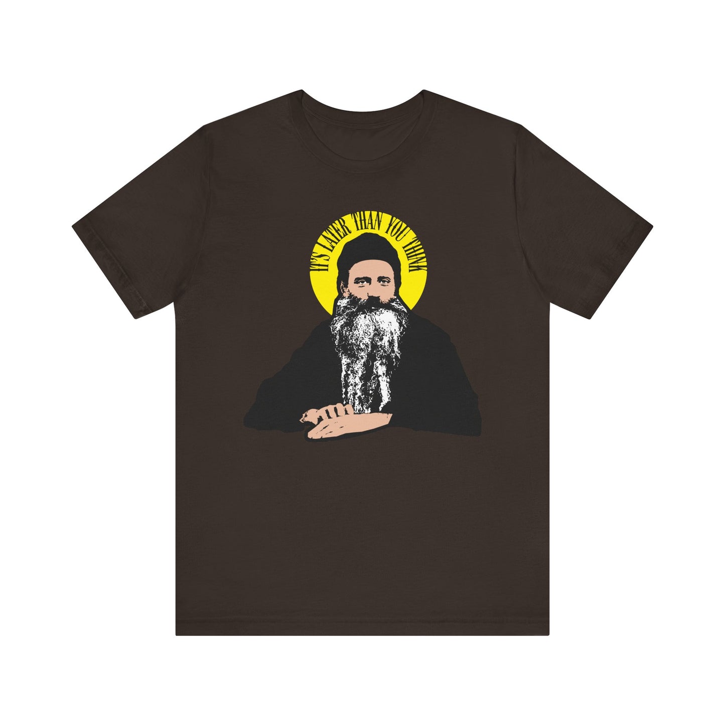 Brown "It's Later Than You Think" tee featuring a modern St. Seraphim Rose illustration with a yellow halo and angels; lightweight cotton unisex design.