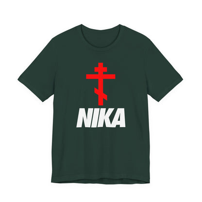 Forest green t-shirt with a minimalist Orthodox cross and bold white NIKA text, inspired by traditional iconography and modern Nike logo mashup. Athletic ascetic fashion expressing “Jesus Christ Conquers.”.