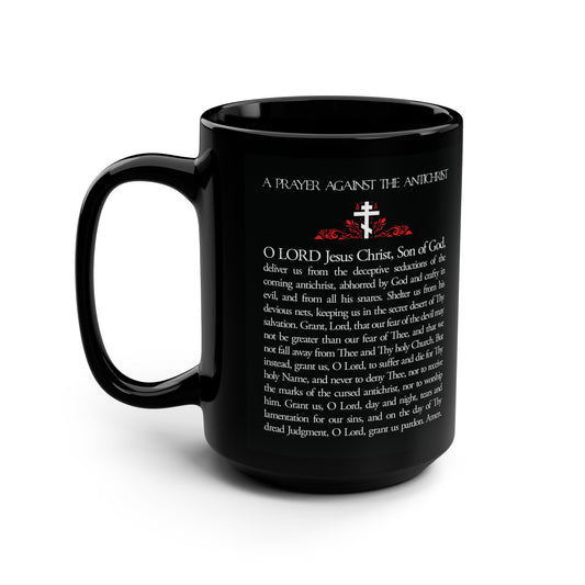 Black mug titled "Prayer Against the Antichrist By Elder Anatoly the Younger of Optina | Christ is King | Book of Revelation" with white text, a small cross with red accents, inspired by Orthodox Christian prayer.