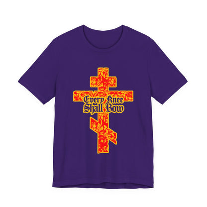 Unisex "Every Knee Shall Bow" Christian tee features a gold and red floral Orthodox cross with gothic lettering, inspired by Isaiah 45:22–24 and Philippians 2:7–11.