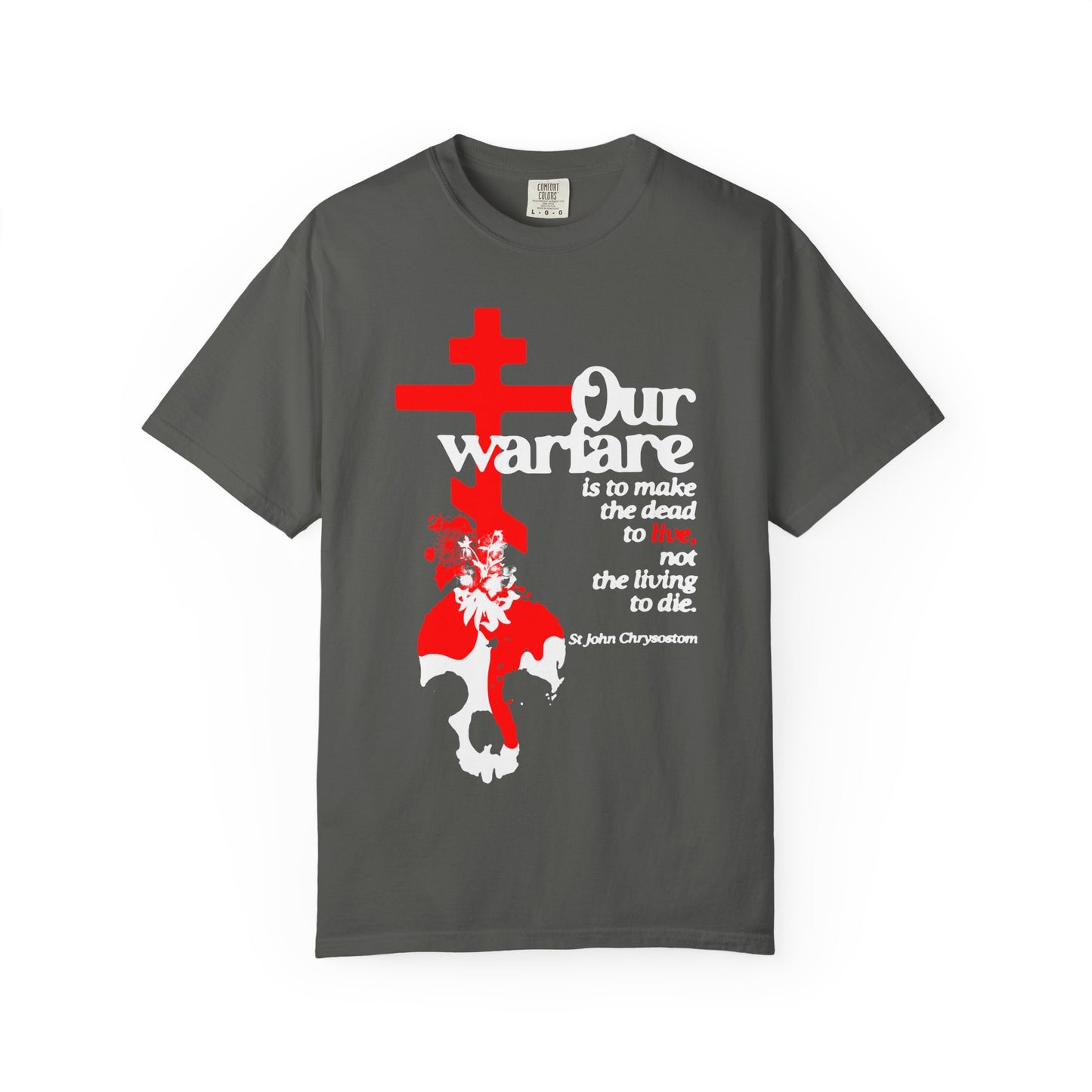 Pepper-colored heavyweight cotton unisex tee, titled "Our Warfare is to Make the Dead to Live (St. John Chrysostom)," featuring an Orthodox cross, white skull adorned with flowers and a figure above it, along with white and red text—symbolizing Christian power and the enduring strength of priesthood authority.