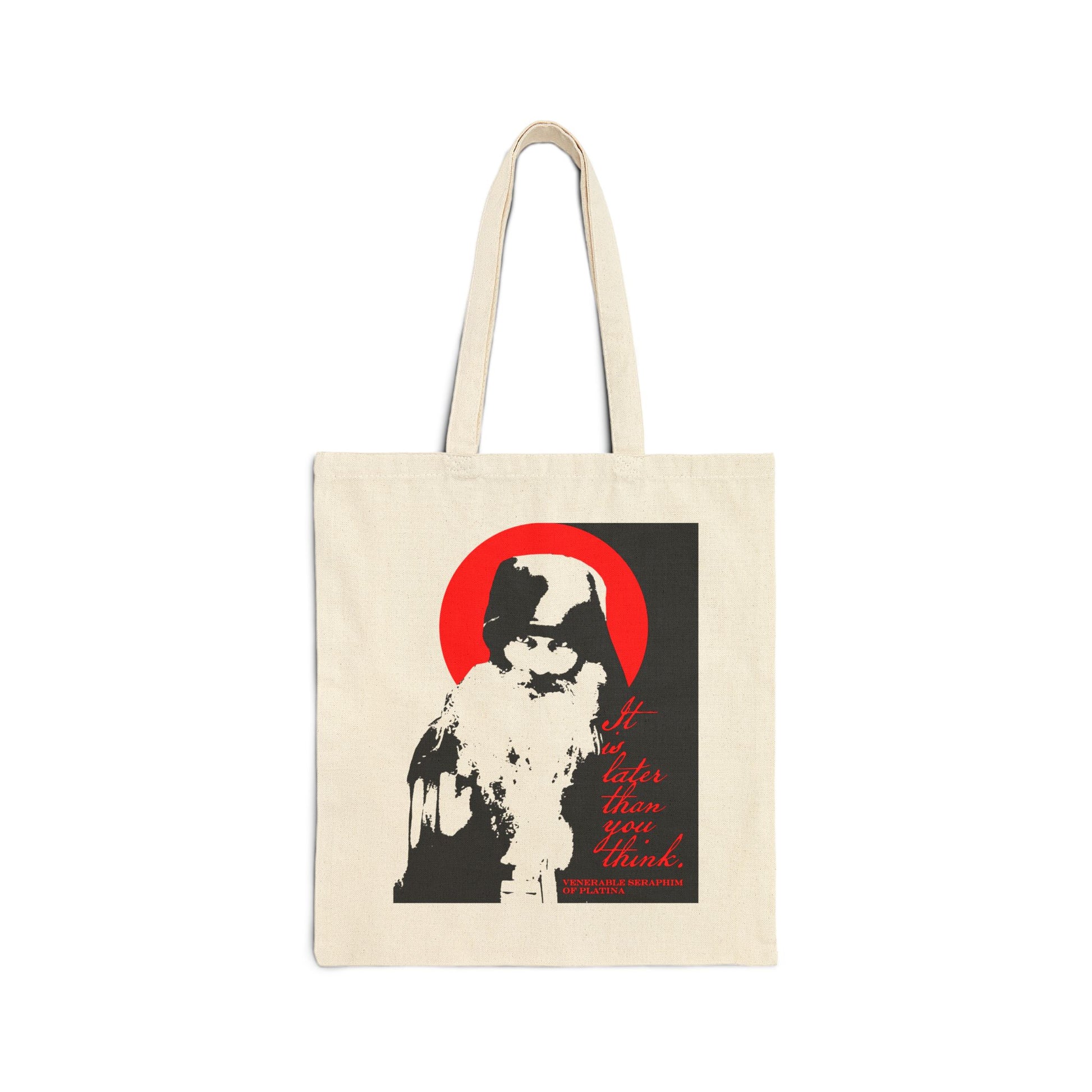 The "It's Later Than You Think" canvas tote bag by Remembrance of Death features a high-contrast black and white image of Fr Seraphim Rose before a red circle, with red Orthodox-inspired text reminding, "It's later than you think.
